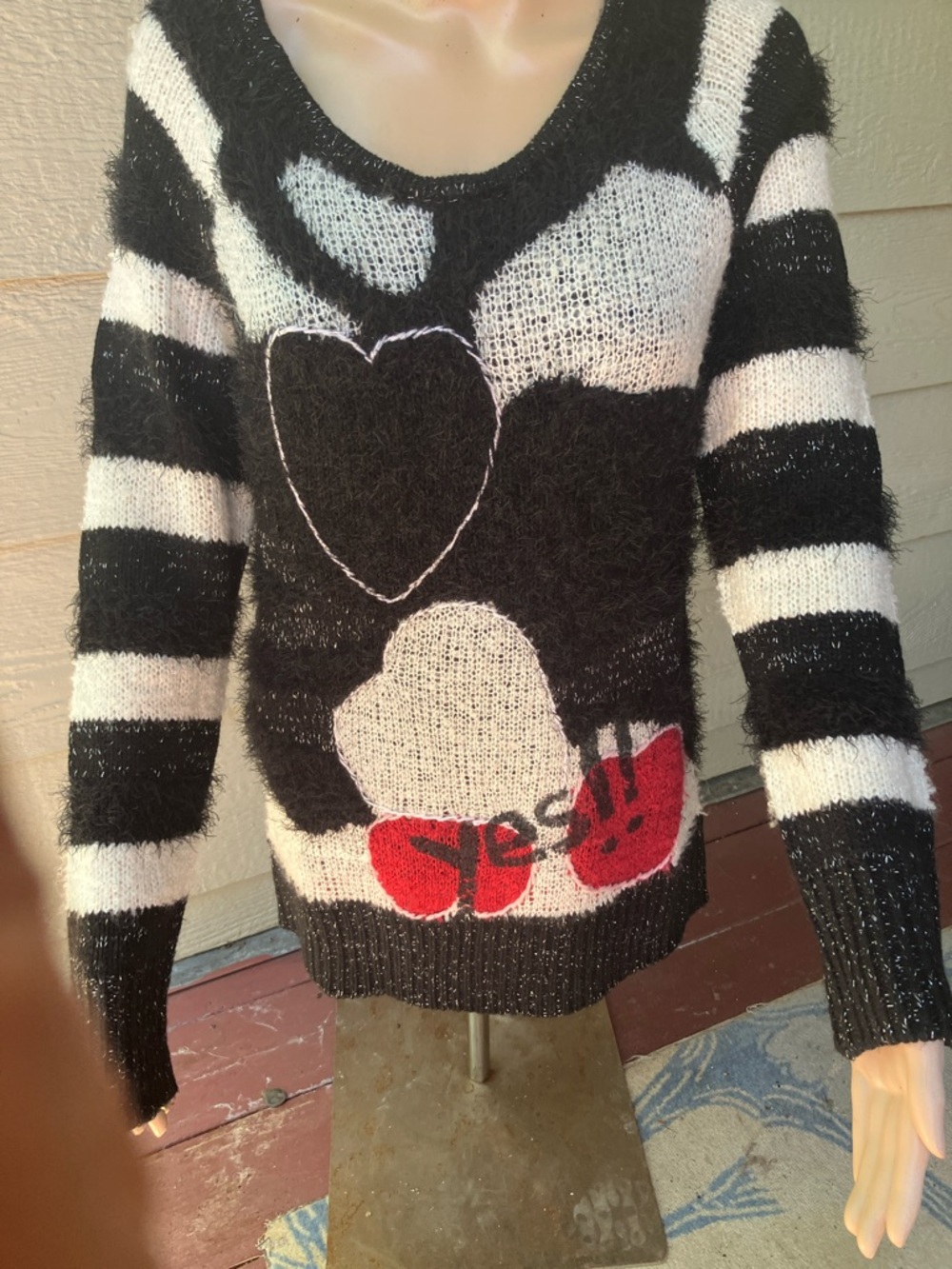 Fun, black and white and red sweater or for you skinny gal maybe a mini shift